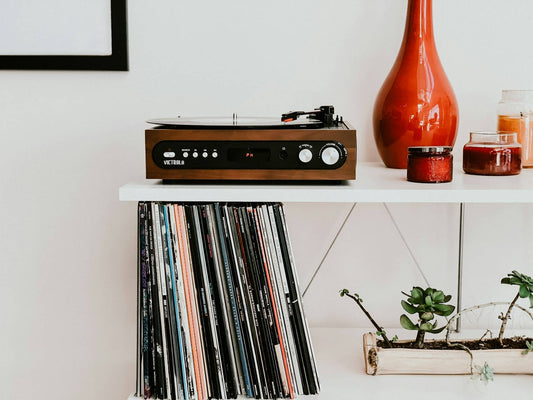vinyl record player on a white table