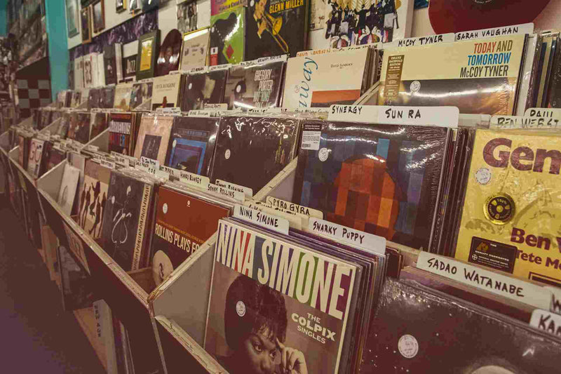 rows of vinyl records at a store