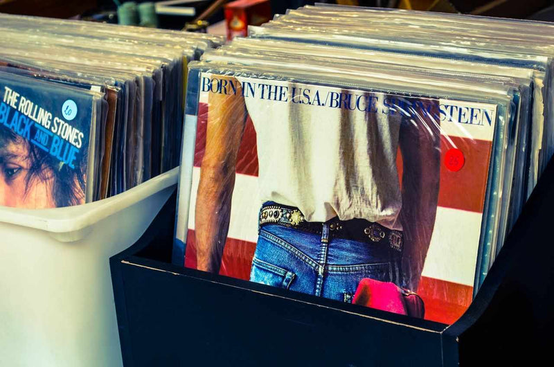 Bins of classic vinyl records including Born in the USA by Bruce Springsteen