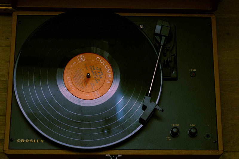 a black record sits on a record player