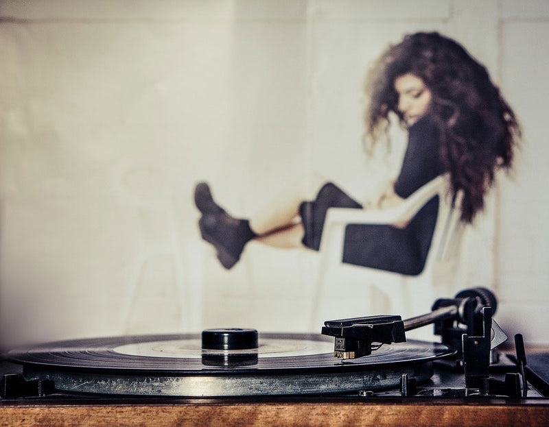 girl listening to a vinyl record