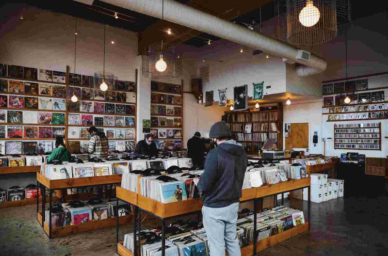 people shopping in a record store