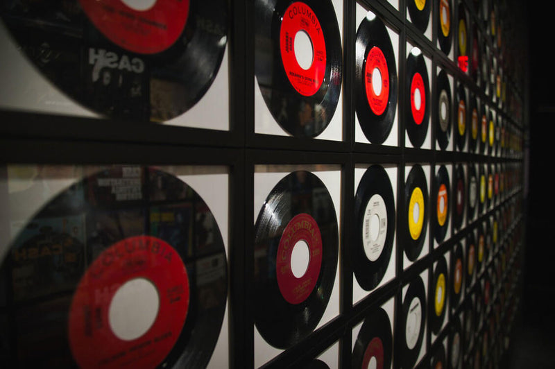vinyl records framed on a wall 