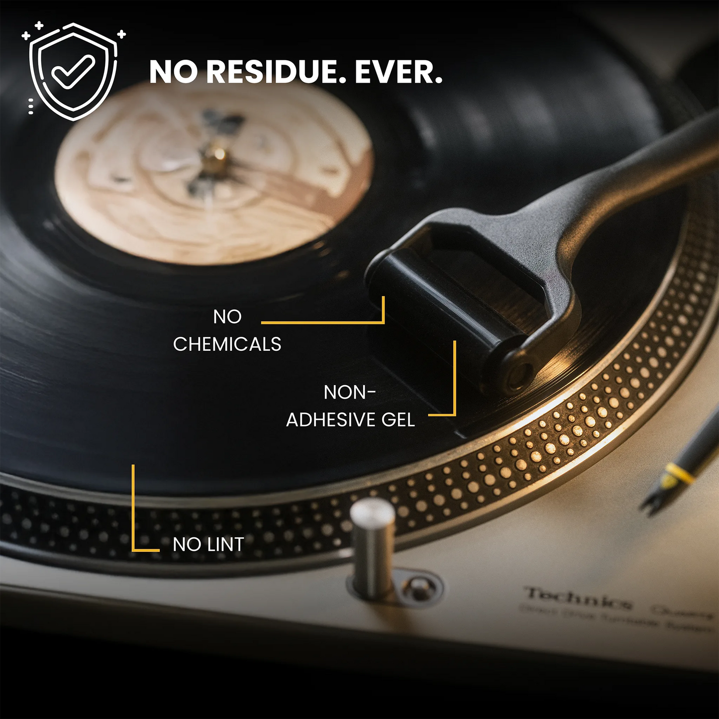 Close-up of a vinyl record on a turntable with text overlays reading 'NO RESIDUE. EVER.