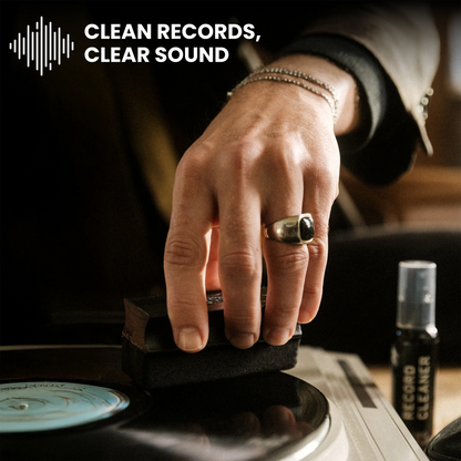 A close-up of a person's hand resting on a vinyl record, with a small bottle labeled 'RECORD CLEANER' nearby. The text 'CLEAN RECORDS, CLEAR SOUND' appears at the top with a soundwave icon.
