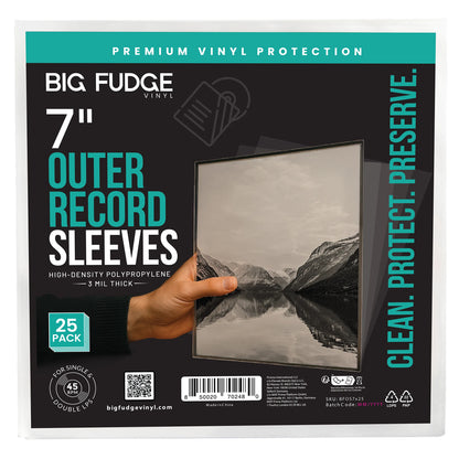 Big Fudge Vinyl 7-inch outer record sleeves in a 25-pack, shown in retail packaging with a hand holding a sample sleeve featuring a grayscale mountain landscape. _7 inch _25x pack