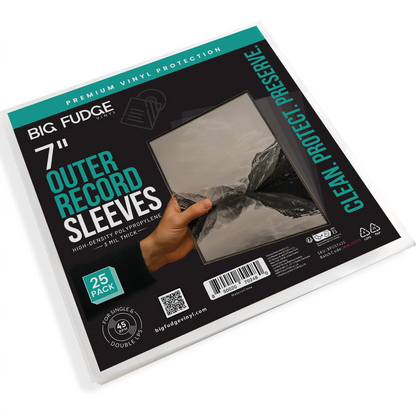 A package of Big Fudge 7-inch outer record sleeves, 25-pack, shown at an angle on a white background. The packaging is black with teal and white text, featuring a graphic of a hand holding a sleeve over a mountain landscape. _7 inch _25x pack