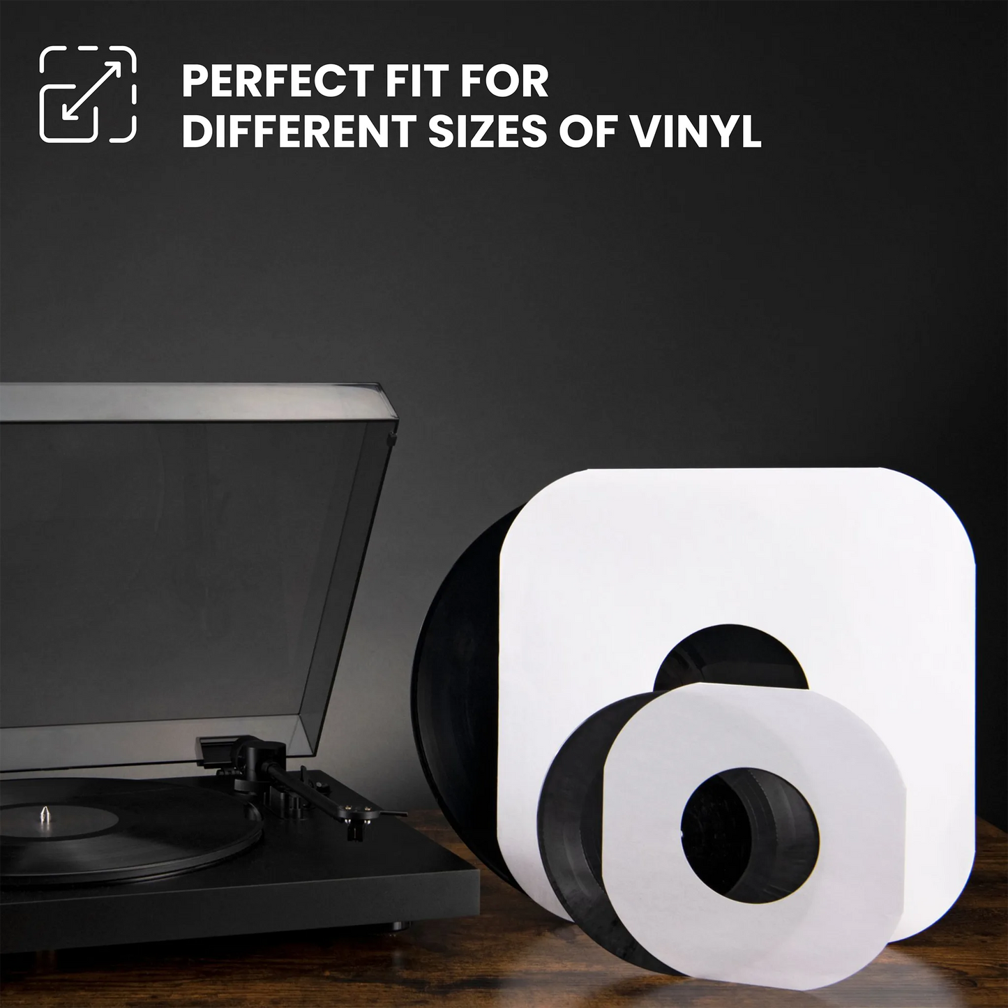 White vinyl record sleeves with black centers, shown alongside a turntable and a black vinyl record on a dark background, with text reading 'PERFECT FIT FOR DIFFERENT SIZES OF VINYL'. _12 inch
