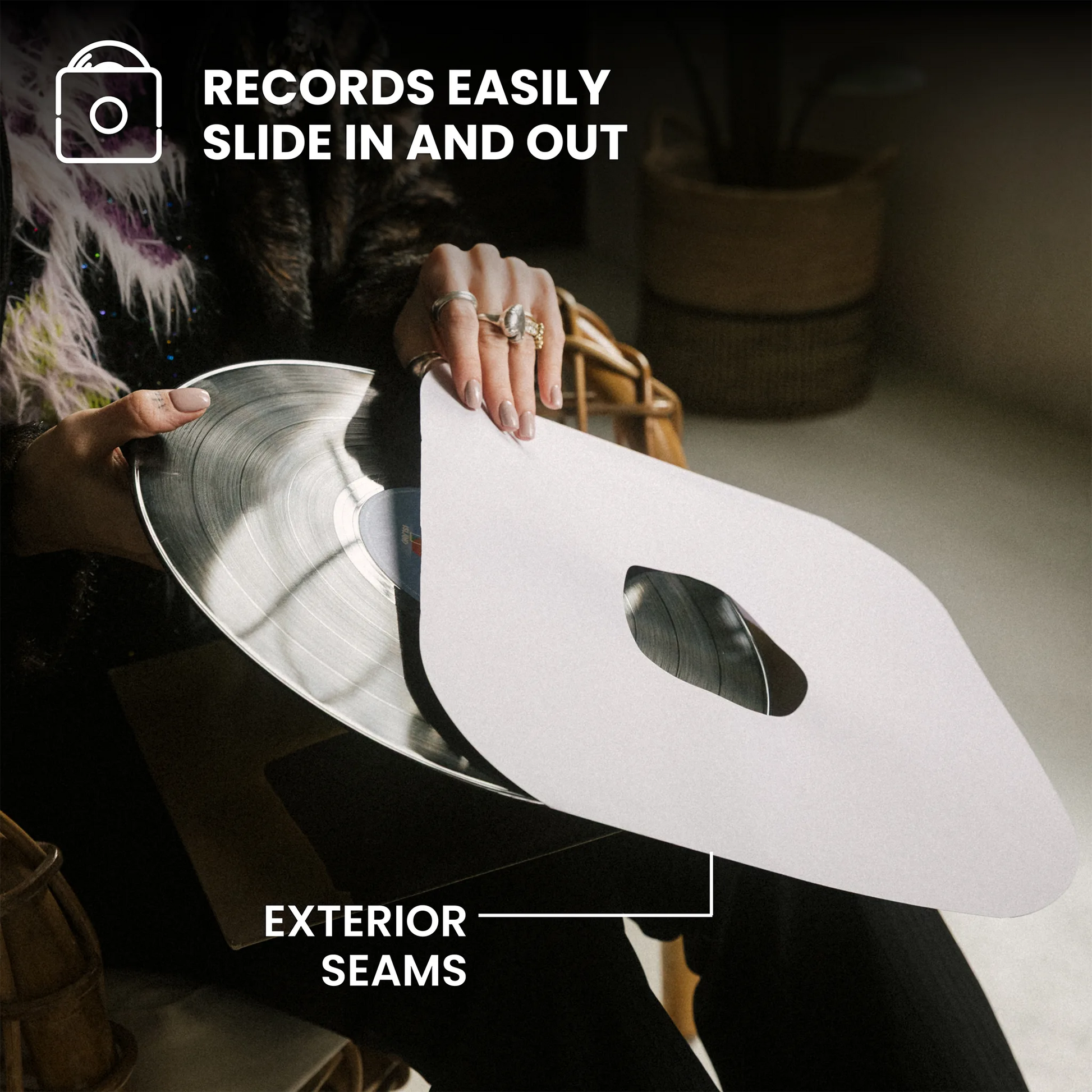A person holds a white vinyl record cutter template with a cutout shape over a vinyl record, with text overlays reading 'RECORDS EASILY SLIDE IN AND OUT' and 'EXTERIOR SEAMS'. _12 inch