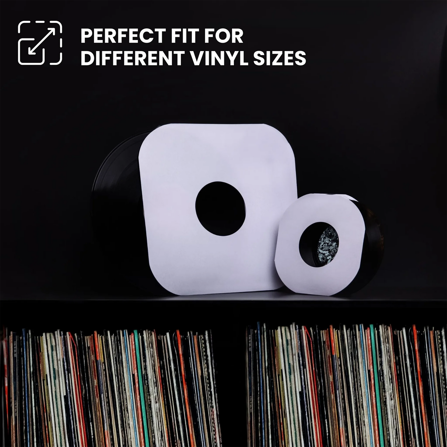 Two white vinyl record sleeves with circular cutouts displayed on a black shelf in front of a record rack, with text at the top reading 'PERFECT FIT FOR DIFFERENT VINYL SIZES'. _7 inch