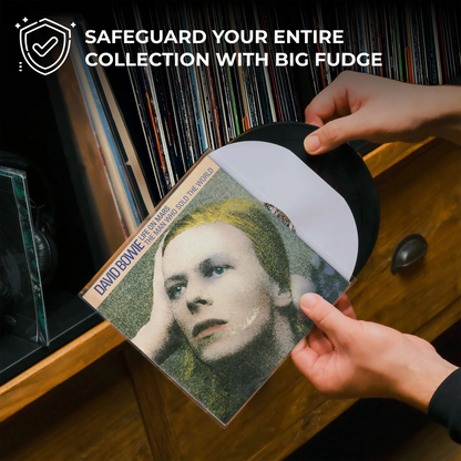 A person's hands are holding a David Bowie 'The World Is Not Enough' vinyl record, showing the black LP and white inner sleeve against a background of a wooden record cabinet filled with vinyl records. A promotional text overlay at the top reads 'SAFEGUARD YOUR ENTIRE COLLECTION WITH BIG FUDGE'. _7 inch
