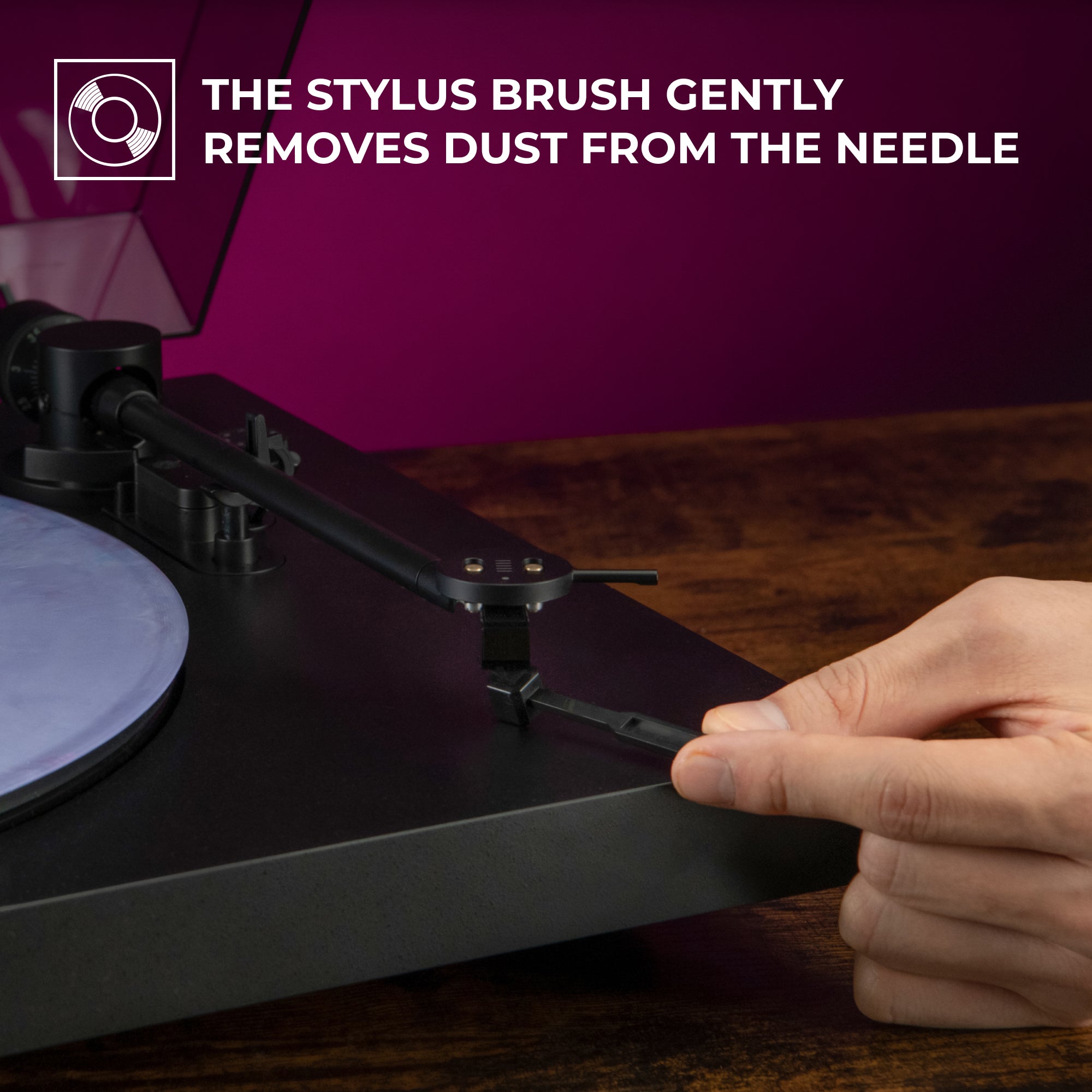 Stylus brush removes dust from needle